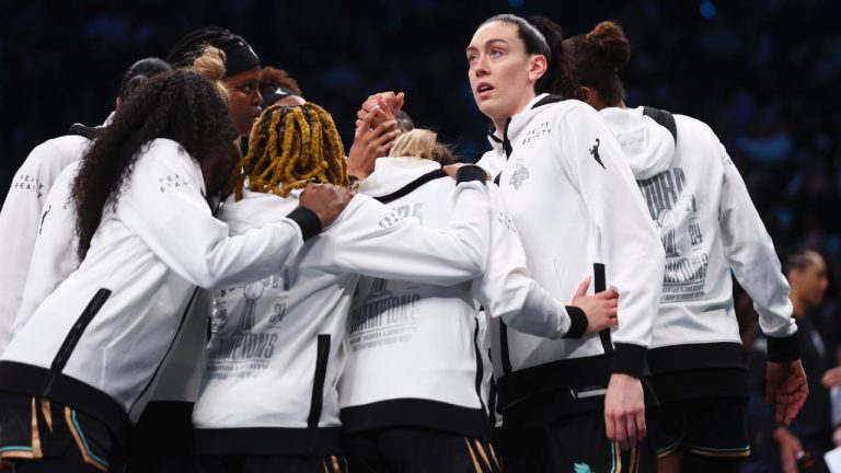 New York Liberty players, including Breanna Stewart, right, huddle before the start of a WNBA basketball game against the Las Vegas Aces, Saturday, May 17, 2025, in New York. (Heather Khalifa/AP)