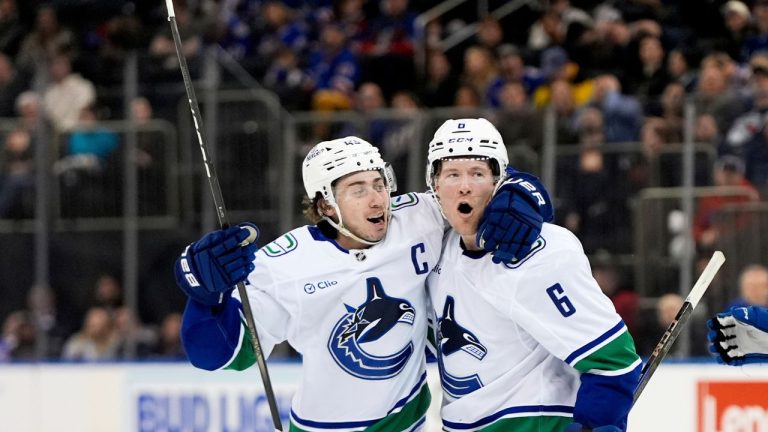 Vancouver Canucks right wing Brock Boeser (6) celebrates with defenceman Quinn Hughes (43) after scoring a goal during the third period of an NHL hockey game against the New York Rangers, Saturday, March 22, 2025, in New York. (Julia Demaree Nikhinson/AP)
