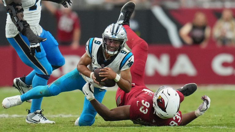 Carolina Panthers quarterback Bryce Young (9) is tackled by Arizona Cardinals defensive tackle Calais Campbell (93) during the second half of an NFL football game, Sunday, Sept. 14, 2025, in Glendale, Ariz. (Rick Scuteri/AP)