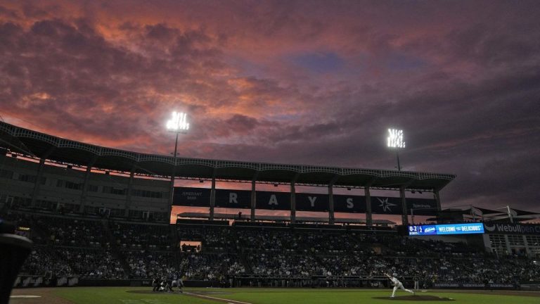 The sun sets over Steinbrenner Field during the second inning of a baseball game between the Tampa Bay Rays and the Seattle Mariners Wednesday, Sept. 3, 2025, in Tampa, Fla. (Chris O'Meara/AP)