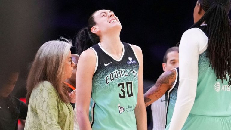 New York Liberty forward Breanna Stewart (30) grimaces after getting fouled by the Phoenix Mercury during the second half of Game 1 during the first round of the WNBA basketball playoffs Sunday, Sept. 14, 2025, in Phoenix. (Darryl Webb/AP)