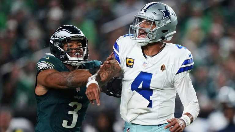 Dallas Cowboys quarterback Dak Prescott (4) releases a pass under pressure from Philadelphia Eagles linebacker Nolan Smith Jr. (3) in the second half of an NFL football game Thursday, Sept. 4, 2025, in Philadelphia. (Matt Slocum/ AP Photo)