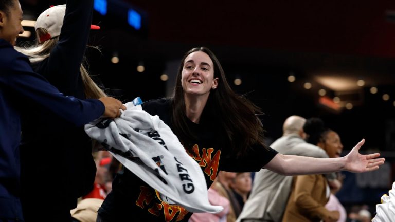 Indiana Fever guard Caitlin Clark, center, reacts after a score to take the lead over the Atlanta Dream during the second half of Game 3 in the first round of the WNBA basketball playoffs, Sept. 18, 2025, in Atlanta. (Butch Dill/AP Photo)