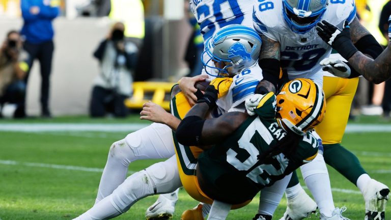 Green Bay Packers defensive end Rashan Gary (52) tackles Detroit Lions quarterback Jared Goff (16) pulling him out of the end zone during the second half of an NFL football game, Sept. 7, 2025, in Green Bay, Wis. (AP Photo/Mike Roemer)
