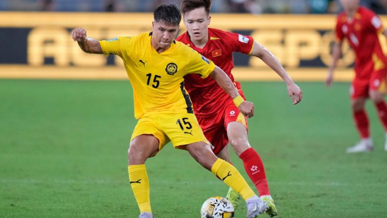 Malaysia's Nooa Laine, foreground, vies for the ball with Vietnam's Nguyen Hoang Duc during the AFC Asian Cup qualifier Group F soccer match between Malaysia and Vietnam at the National Stadium Bukit Jalil in Kuala Lumpur, Malaysia, June 10, 2025. (Vincent Thian/AP)