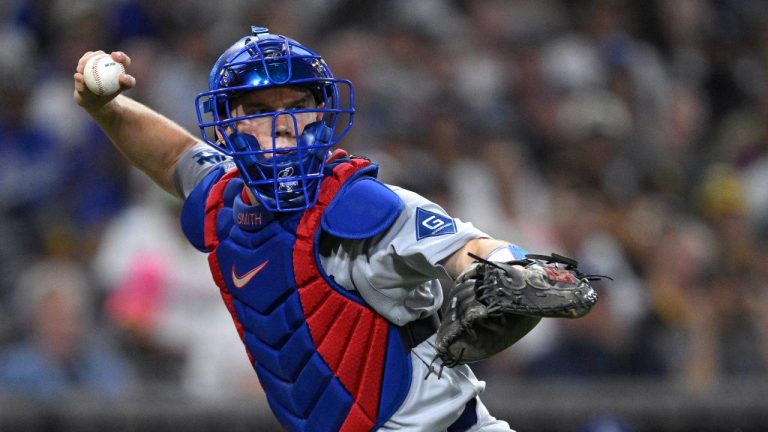 Los Angeles Dodgers' Will Smith throws to first base during the fourth inning of a baseball game against the San Diego Padres Friday, Aug. 22, 2025, in San Diego. (Orlando Ramirez/AP)