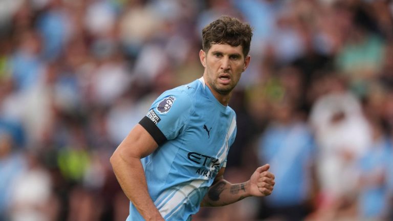 Manchester City's John Stones runs on the pitch during the English Premier League soccer match between Wolverhampton Wanderers and Manchester City at Molineux Stadium, Wolverhampton, England, Saturday, Aug. 16, 2025. (Dave Shopland/AP)