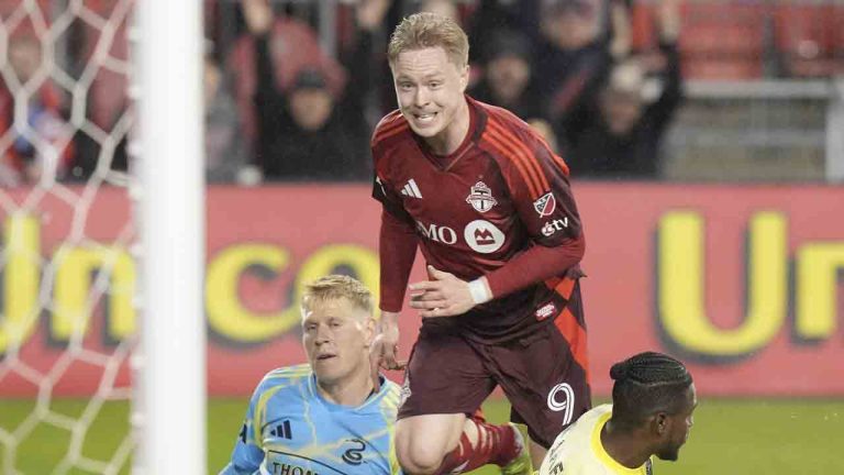 Toronto FC's Ola Brynhildsen (9) celebrates in front of Philadelphia Union defender Jakob Glesnes and goalkeeper Andre Blake after scoring during second half MLS action in Toronto, on Wednesday, May 28, 2025. (Chris Young/CP)