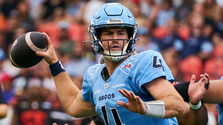 Toronto Argonauts quarterback Nick Arbuckle (4) looks downfield to make a pass during first half CFL action against the B.C. Lions in Toronto, on Saturday, Aug. 23, 2025. (Sammy Kogan/CP)