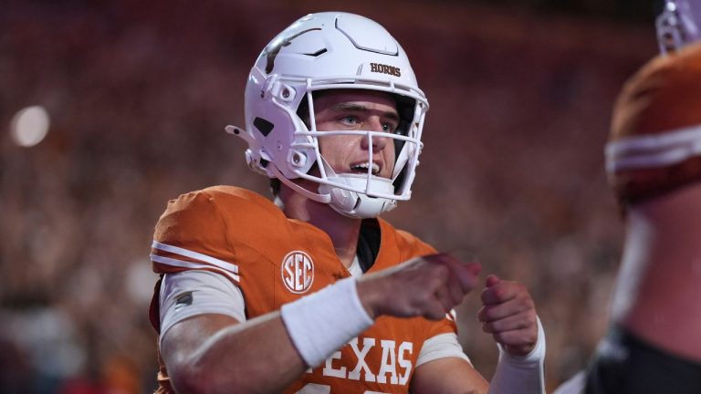 Texas quarterback Arch Manning (16) celebrates with teammates after he scored a touchdown against Sam Houston State during the first half of an NCAA college football game in Austin, Texas, Saturday, Sept. 20, 2025. (Eric Gay/AP Photo)