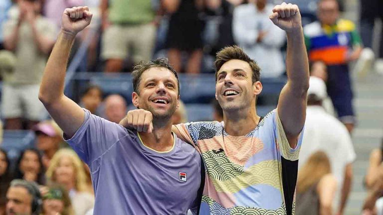 Horacio Zeballos, of Argentina, left, and Marcel Granollers, of Spain, react after defeating Neal Skupski, of Great Britain, and Joe Salisbury, of Great Britain, in the men's doubles final of the U.S. Open tennis championships, Saturday, Sept. 6, 2025, in New York. (Yuki Iwamura/AP)