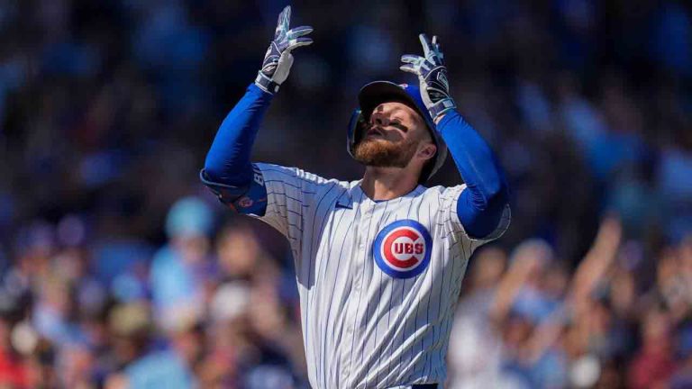 Chicago Cubs' Michael Busch (29) gestures skyward as he crosses home plate after hitting a home run during the first inning of a baseball game against the St. Louis Cardinals, Saturday, Sept. 27, 2025, in Chicago. (Erin Hooley/AP)