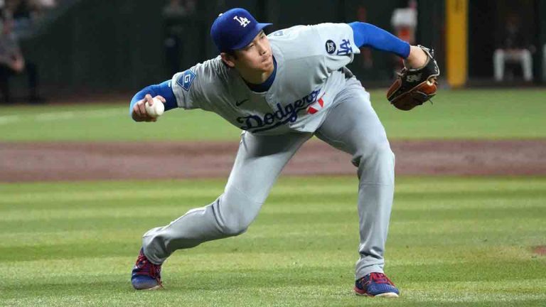 Los Angeles Dodgers pitcher Shohei Ohtani fields the ball hit by Arizona Diamondbacks' Alek Thomas in the third inning of a baseball game, Tuesday, Sept. 23, 2025, in Phoenix. (Rick Scuteri/AP)