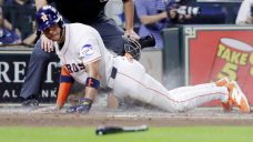 Astros hold off Rangers to improve wild-card position