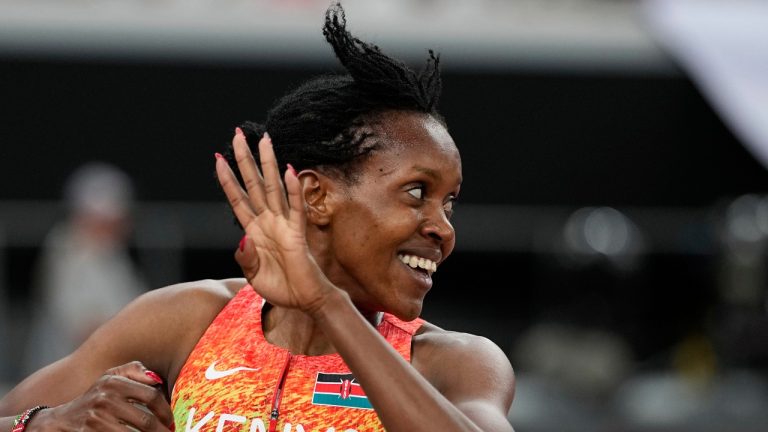 Kenya's Faith Kipyegon gestures and looks back after crossing the finish line to win the gold medal in the women's 1,500 meters final at the World Athletics Championships in Tokyo, Tuesday, Sept. 16, 2025. (Matthias Schrader/AP)