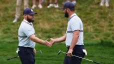 Europe takes early Ryder Cup lead to quiet American crowd