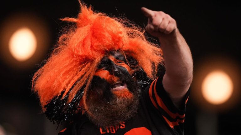 A B.C. Lions fan cheers as the team plays the Montreal Alouettes during a CFL football game, in Vancouver, on Saturday, August 16, 2025. (Darryl Dyck/THE CANADIAN PRESS)