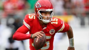 Kansas City Chiefs quarterback Patrick Mahomes runs the ball in for a touchdown against the Philadelphia Eagles during the second quarter of an NFL football game, Sunday, Sept. 14, 2025 in Kansas City, Mo. (Reed Hoffmann/AP)