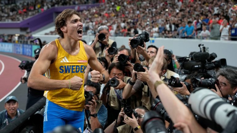Sweden's Armand Duplantis celebrates after making a clearance to break the world record after winning gold in the men's pole vault final at the World Athletics Championships in Tokyo, Monday, Sept. 15, 2025. (Louise Delmotte/AP)