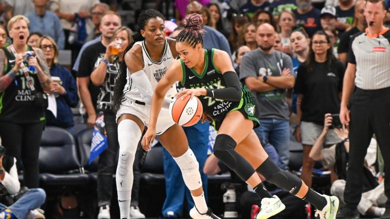 Minnesota Lynx forward Napheesa Collier, right, drives past Golden State Valkyries center Temi Fagbenle (14) during the first half of an WBA basketball game Sunday, Sept. 14, 2025 in Minneapolis. (Craig Lassig/AP)