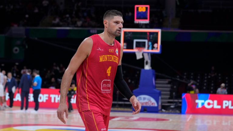 Montenegro centre Nikola Vucevic (4) leaves the court after being named player of the game following a Basketball World Cup second-round match against Greece in Manila, Philippines Sunday, Sept. 3, 2023. Montenegro defeated Greece 73-69.(Michael Conroy/AP)