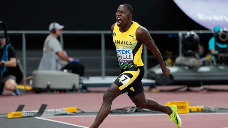 Jamaica's Oblique Seville crosses the finish line to win the men's 100 meters final at the World Athletics Championships in Tokyo, Sunday, Sept. 14, 2025. (Matthias Schrader/AP)