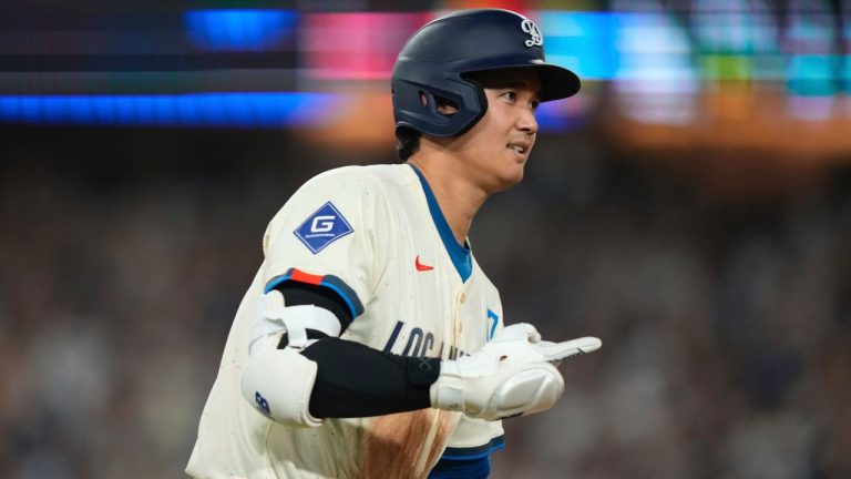 Los Angeles Dodgers' Shohei Ohtani heads to first after hitting a solo home run during the sixth inning of a baseball game against the San Francisco Giants, Saturday, Sept. 20, 2025, in Los Angeles. (Mark J. Terrill/AP Photo)
