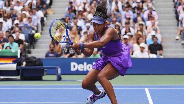 Naomi Osaka, of Japan, returns a shot against Coco Gauff, of the United States, during the fourth round of the US Open tennis championships. (Kirsty Wigglesworth/AP)