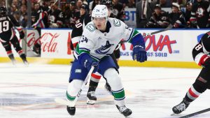 Vancouver Canucks centre Aatu Raty pushes the puck past the blue line during the second period of an NHL game against the Buffalo Sabres, Friday, Nov. 29, 2024, in Buffalo, N.Y. (Jeffrey T. Barnes/AP)