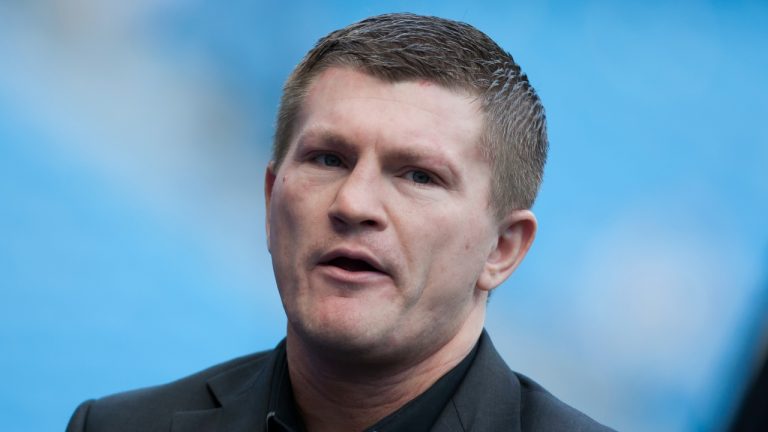 Boxer Ricky Hatton stands by the pitch before Manchester City's English Premier League soccer match against Manchester United at the Etihad Stadium, Manchester, England, Sunday Sept. 22, 2013. (Jon Super/AP)