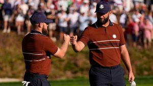 Europe's Tyrrell Hatton celebrates with Jon Rahm on the sixth hole at Bethpage Black golf course during the Ryder Cup golf tournament. (Robert Bukaty/AP)
