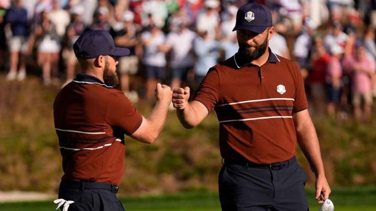 Europe's Tyrrell Hatton celebrates with Jon Rahm on the sixth hole at Bethpage Black golf course during the Ryder Cup golf tournament. (Robert Bukaty/AP)