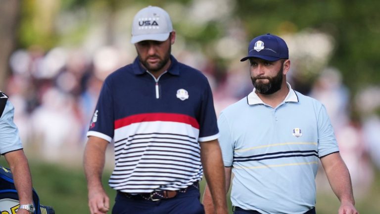 United States' Scottie Scheffler and Europe's Jon Rahm walk on the 13th hole at Bethpage Black golf course during the Ryder Cup golf tournament, Friday, Sept. 26, 2025, in Farmingdale, N.Y. (Matt Slocum/AP Photo)