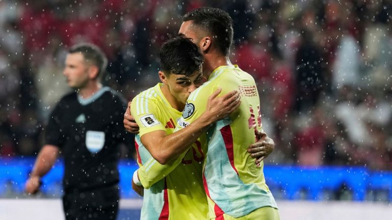 Spain's Pedri, left, is congratulated by Ferran Torres after scoring his side's 6th goal during a World Cup qualifying round Group E soccer match between Turkey and Spain at Konya Buyuksehir stadium, in Konya, Turkey, Sunday, Sept. 7, 2025. (Khalil Hamra/AP Photo)