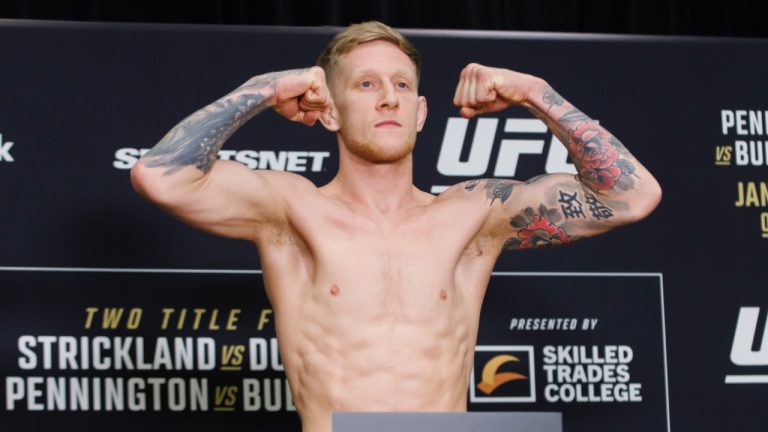 Sam Patterson of Great Britain weighs in ahead of his a UFC welterweight. (Cole Burston/CP)