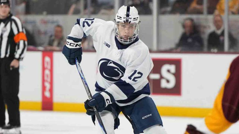 Penn State left winger Gavin McKenna, front left, carries the puck in front of Arizona State Bennett Schimek (23) during the second period of an NCAA college hockey game, Friday, Oct. 3, 2025, in Tempe, Ariz. (Rick Scuteri/AP)