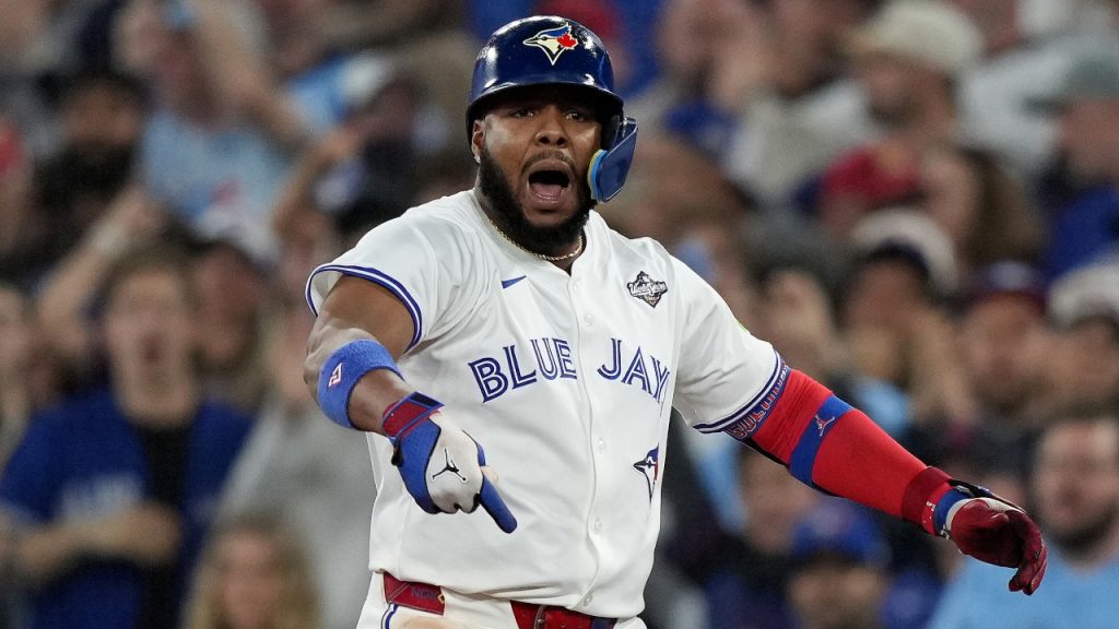 Blue Jays players celebrating during a game.
