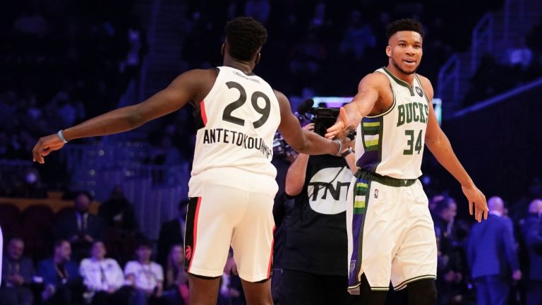 Milwaukee Bucks' Giannis Antetokounmpo (34) greets his brother Toronto Raptors' Alex Antetokounmpo during team part of the skills challenge competition, part of NBA All-Star basketball game weekend, Saturday, Feb. 19, 2022, in Cleveland. (Charles Krupa/AP)