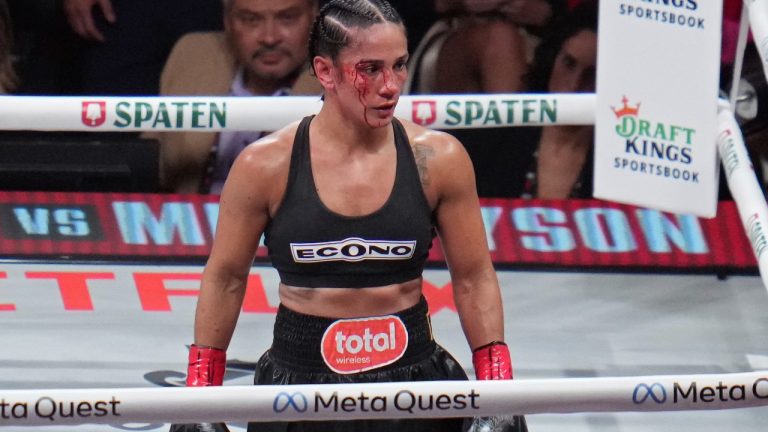 Amanda Serrano walks to her corner between rounds against Katie Taylor during their undisputed super lightweight title bout, Friday, Nov. 15, 2024, in Arlington, Texas. (AP Photo/Julio Cortez)