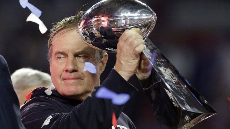 New England Patriots head coach Bill Belichick holds up the Vince Lombardi Trophy as he celebrates after the Patriots defeated the Seattle Seahawks 28-24 in NFL Super Bowl XLIX football game Sunday, Feb. 1, 2015, in Glendale, Ariz. (Patrick Semansky/AP)
