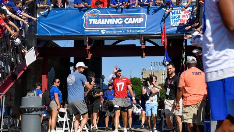 FILE - Buffalo Bills quarterback Josh Allen walks to the field before practice at the team's NFL training camp, Wednesday, July 23, 2025, in Pittsford, N.Y. (AP/Adrian Kraus, File)
