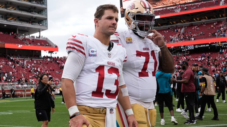 San Francisco 49ers quarterback Brock Purdy and offensive tackle Trent Williams walk off the field after an NFL game against the Jacksonville Jaguars in Santa Clara, Calif., Sunday, Sept. 28, 2025. (Godofredo A. Vasquez/AP)