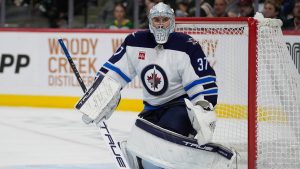 Winnipeg Jets goaltender Connor Hellebuyck defends the goal during the third period of an NHL pre-season game against the Minnesota Wild, Tuesday, Sept. 30, 2025, in St. Paul, Minn. (Abbie Parr/AP)