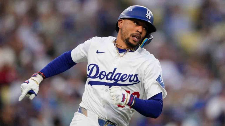 Los Angeles Dodgers' Mookie Betts rounds first base as he doubles during the first inning in Game 2 of the National League Wild Card baseball playoff series against the Cincinnati Reds, Wednesday, Oct. 1, 2025, in Los Angeles. (Mark J. Terrill/AP)