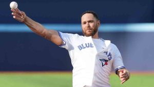 Former Toronto Blue Jays catcher Russell Martin throws out the ceremonial first pitch ahead of the first inning of game 1 in MLB American League Division Series between Toronto and the New York Yankees in Toronto on Saturday, October 4, 2025. (Frank Gunn/CP)