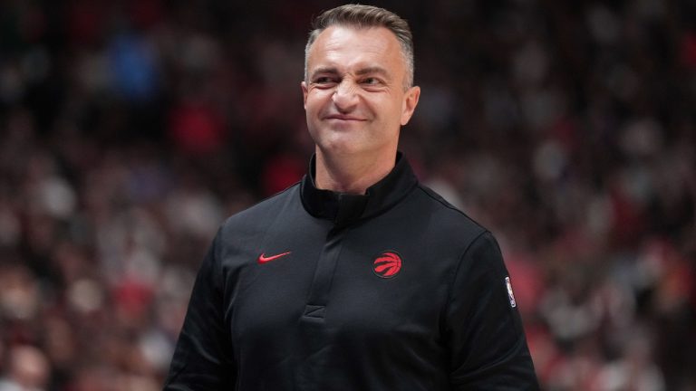 Toronto Raptors head coach Darko Rajakovic walks on the court during a stoppage in play during the first half of a pre-season NBA game against the Denver Nuggets, in Vancouver, B.C., Monday, Oct. 6, 2025. (Darryl Dyck/CP)