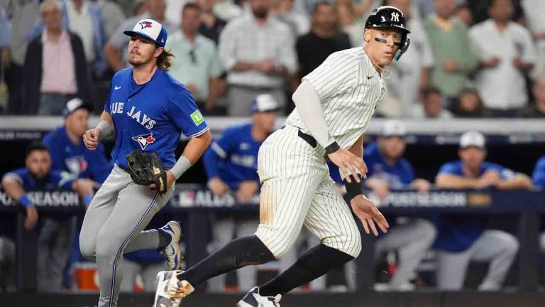 New York Yankees right fielder Aaron Judge gets caught in a rundown between third base and home plate against the Toronto Blue Jays during the third inning of Game 3 of baseball's American League Division Series, Tuesday, Oct. 7, 2025, in New York. (Frank Franklin II/AP)