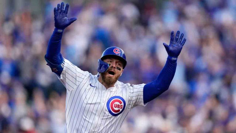 Chicago Cubs' Michael Busch celebrates after hitting a home run during the first inning of Game 3 of baseball's National League Division Series against the Milwaukee Brewers Wednesday, Oct. 8, 2025, in Chicago. (Erin Hooley/AP)