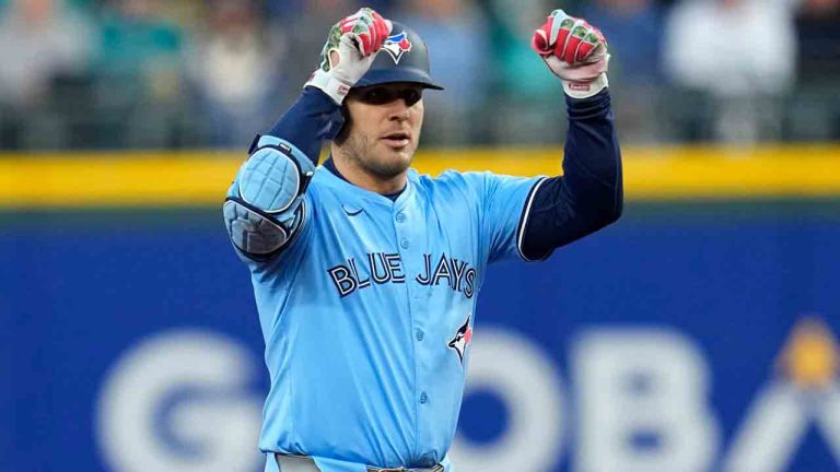 Toronto Blue Jays' Daulton Varsho celebrates his two run double against the Seattle Mariners during the third inning in Game 3 of baseball's American League Championship Series, Wednesday, Oct. 15, 2025, in Seattle. (David J. Phillip/AP)