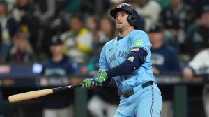 Toronto Blue Jays' George Springer follows through on an RBI double against the Seattle Mariners during the fourth inning in Game 4 of baseball's American League Championship Series, Thursday, Oct. 16, 2025, in Seattle. (Abbie Parr/AP)